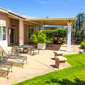 Home backyard with a covered patio